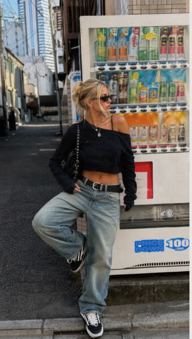 Woman posing by a vending machine